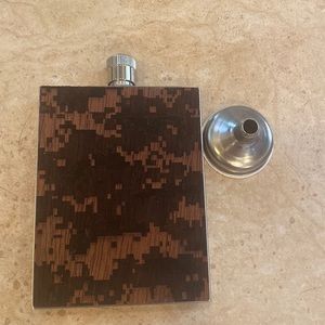 Wooden and metal had made flask
